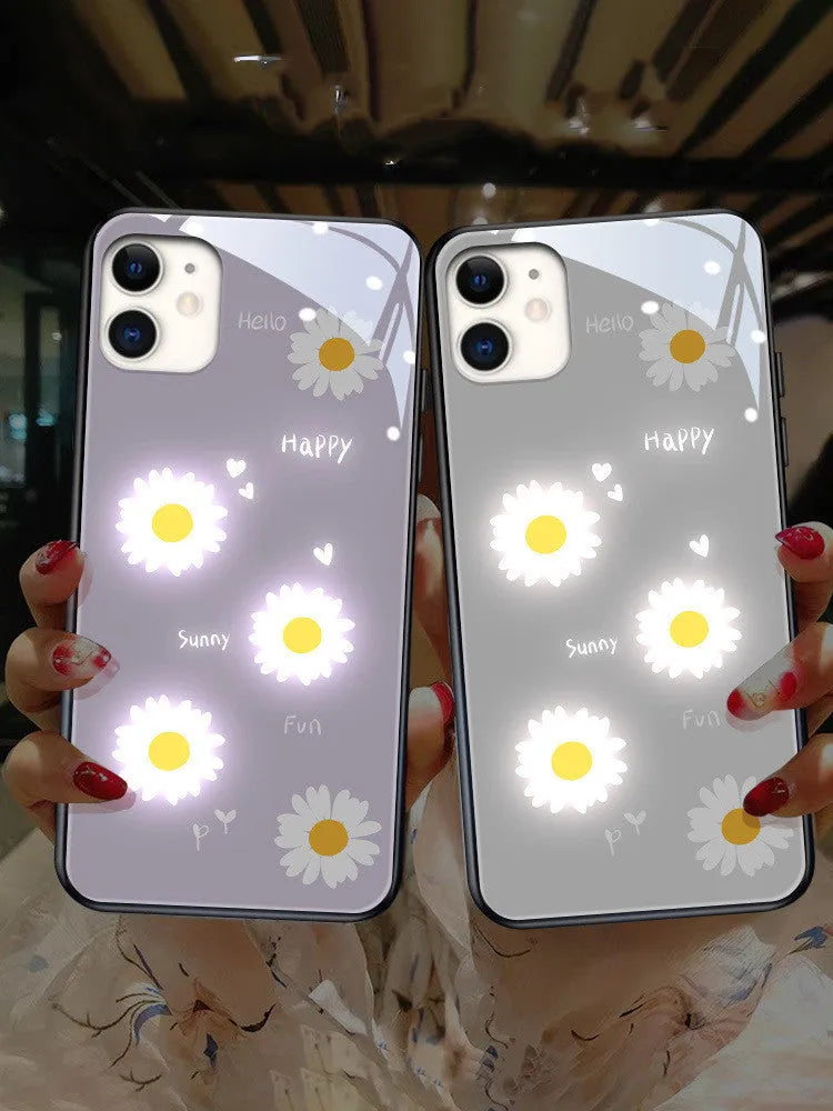 White daisy design luminous iPhone case with voice-activated colour light on a mobile phone.
