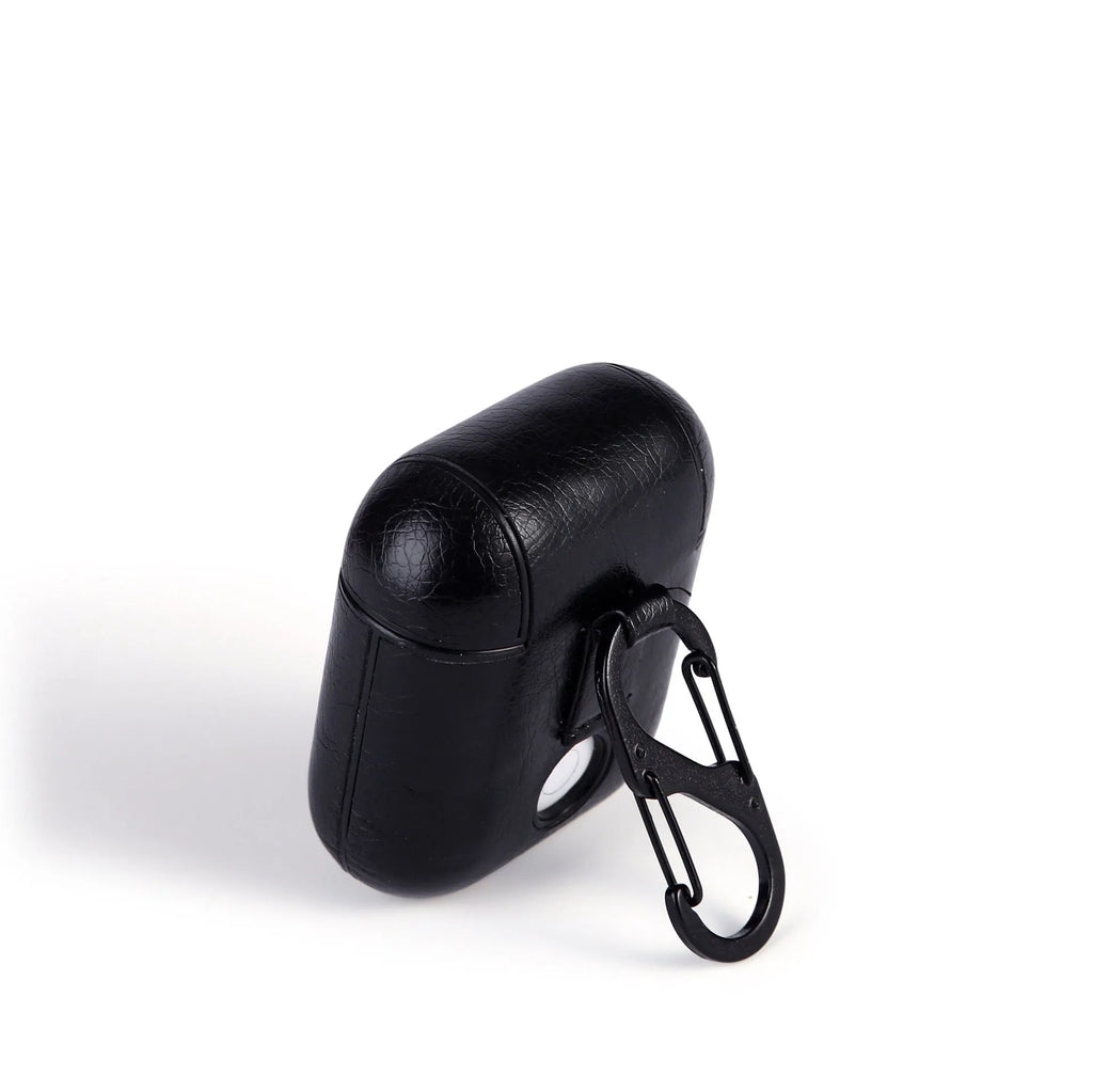 Genuine leather protective case sleeve for Apple Airpods charging case in black, brown, light brown, and red.