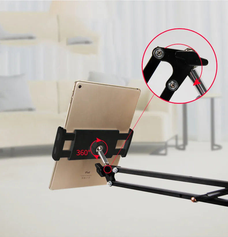 Black and white adjustable phone and tablet stand on a flat surface