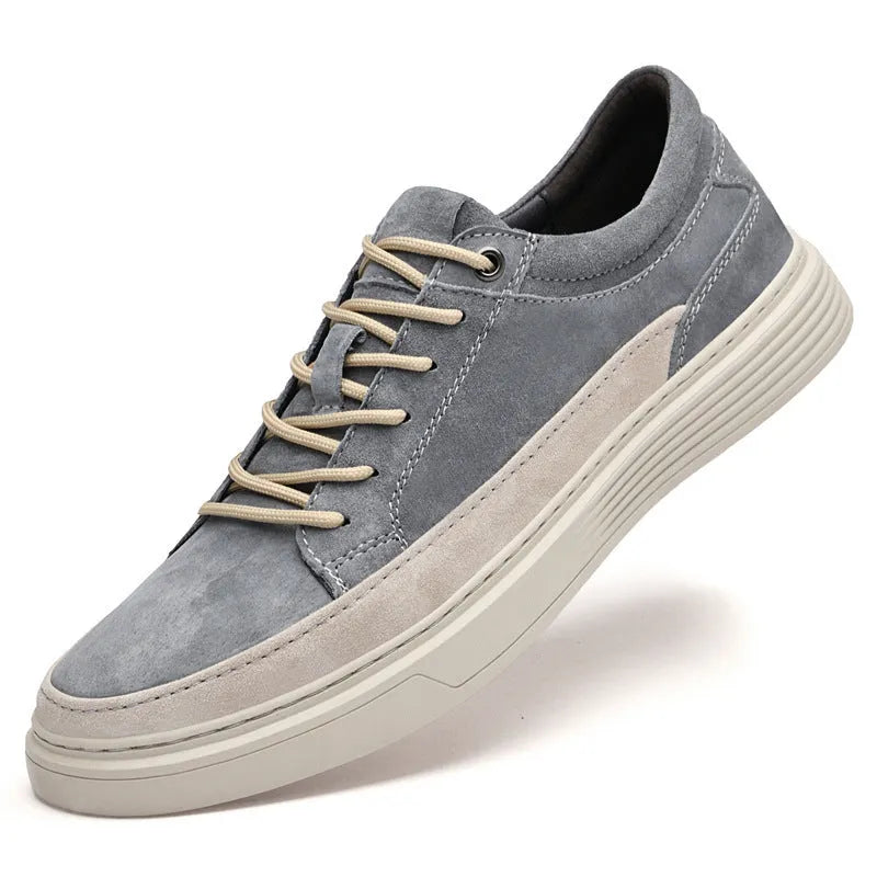 Men's grey casual leather skate shoes with round toe and lace-up front on a rubber sole.