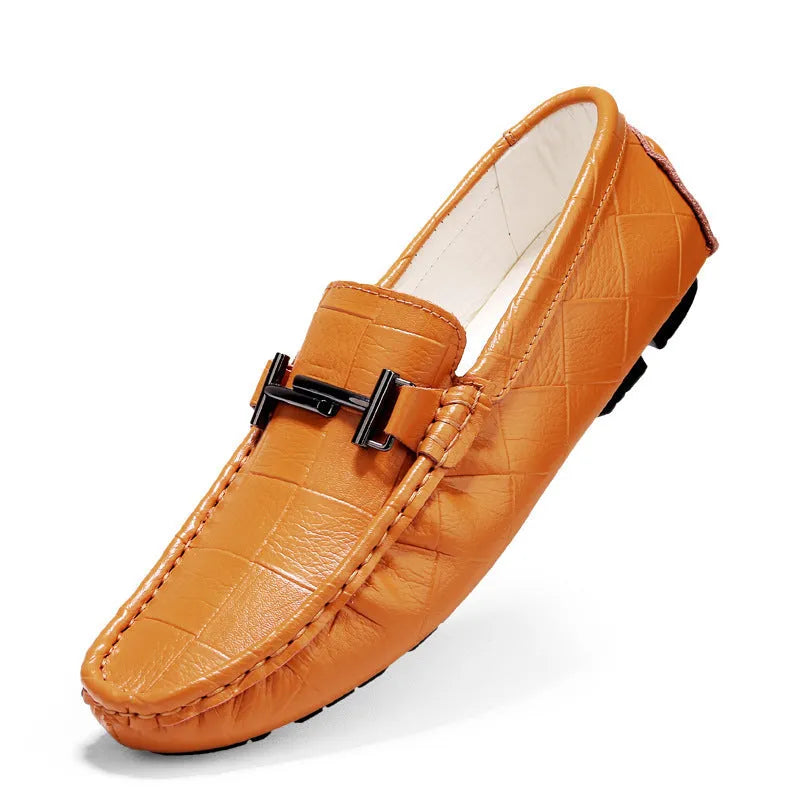 Men's black leather casual shoes with a silver buckle on a flat rubber sole.