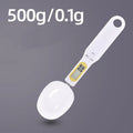 Black electronic measuring spoon scale showing digital display and integrated spoon design for kitchen weighing
