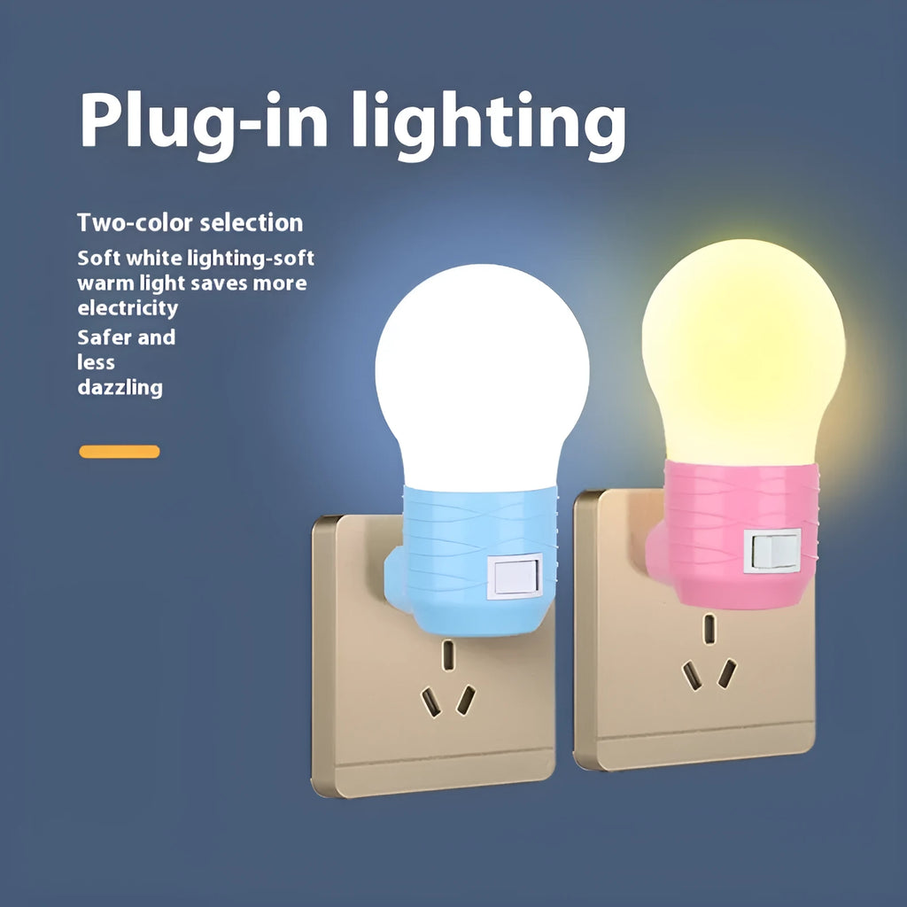 Plug-in baby night light in white shell on a nursery bedside table