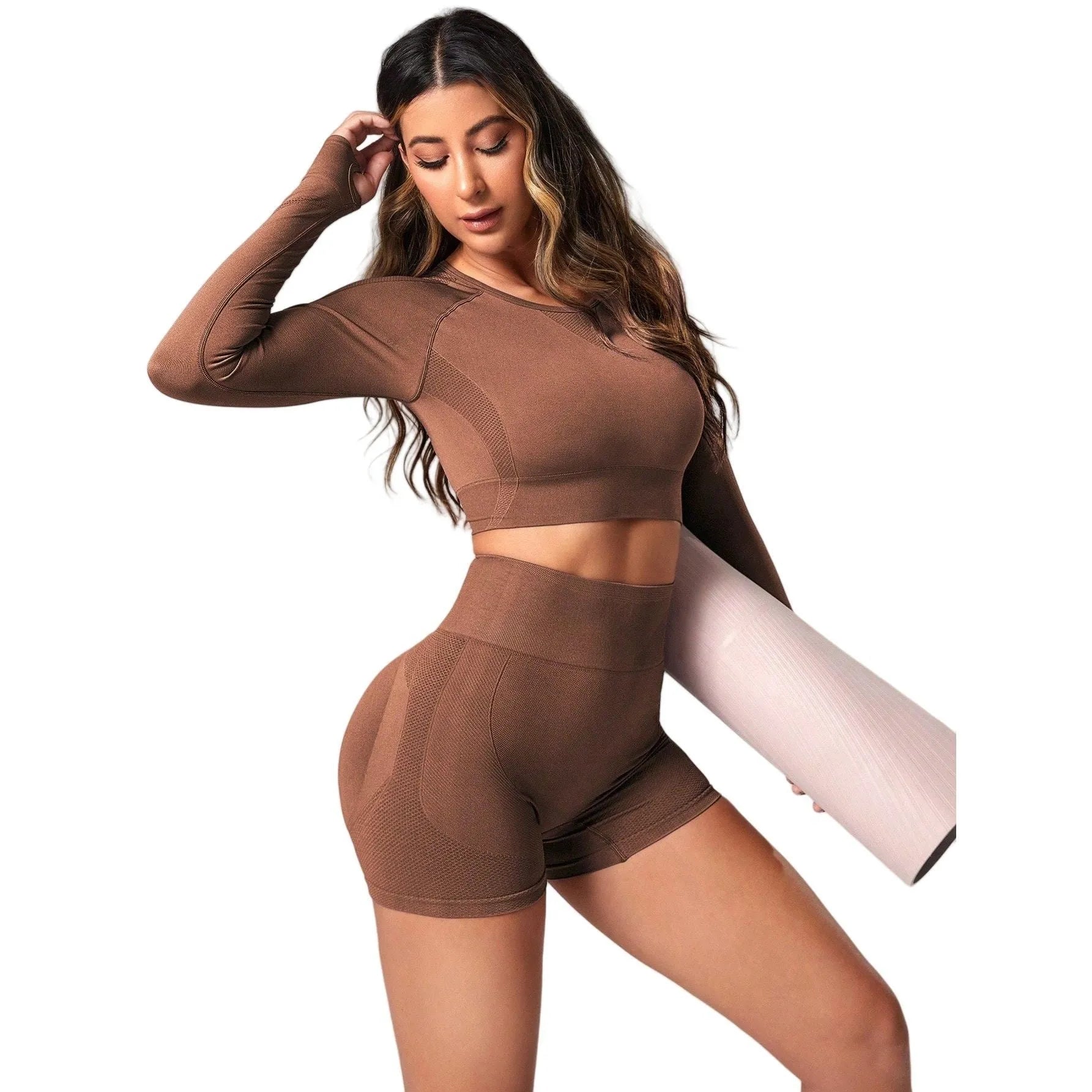 Women's black high-waist yoga suit with long sleeve top and tight-fit pants laid flat.