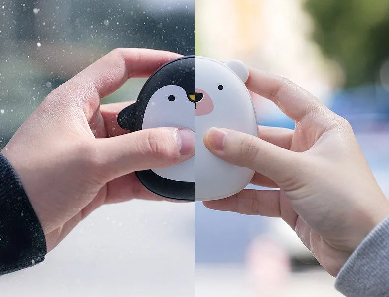 Cute cartoon penguin polar bear design USB rechargeable hand warmer and power bank unit.