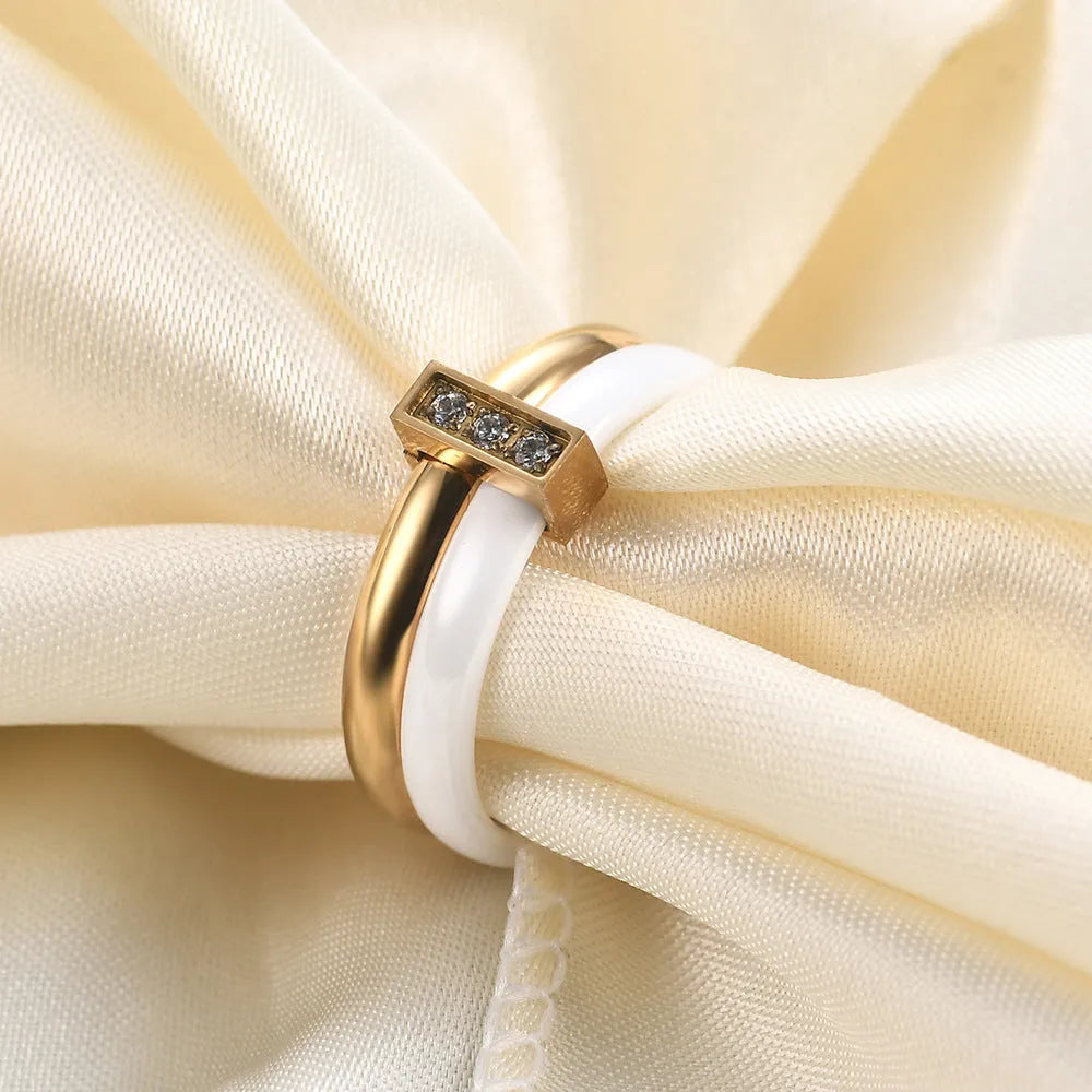 Geometric ceramic women's ring with glossy stitching and zirconium inlays in steel black finish