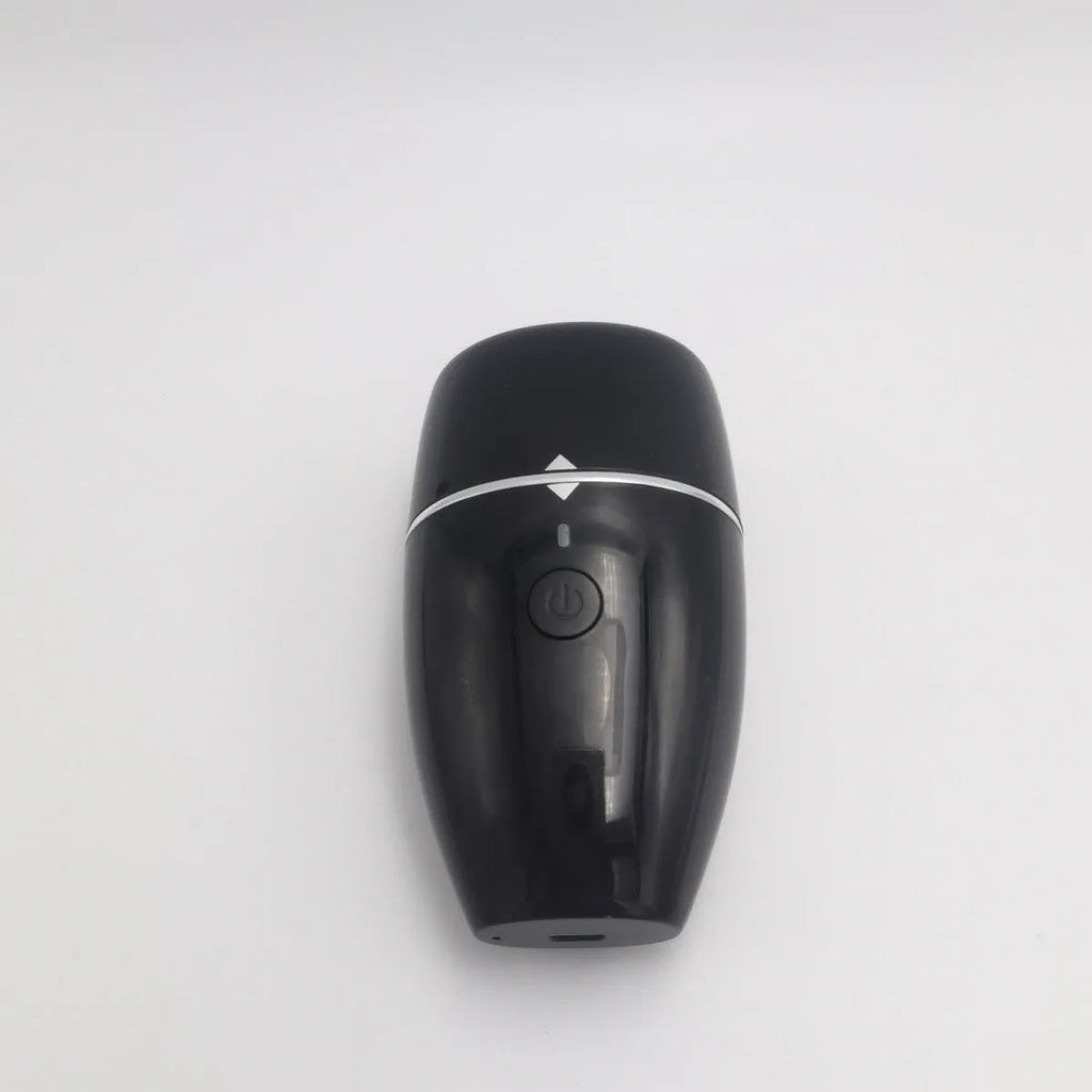 Black and white electric lip plumper device with silicone tip and 3 speed buttons