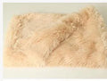 Soft grey plush dog blanket lying flat, showing its size next to a medium-sized dog kennel.