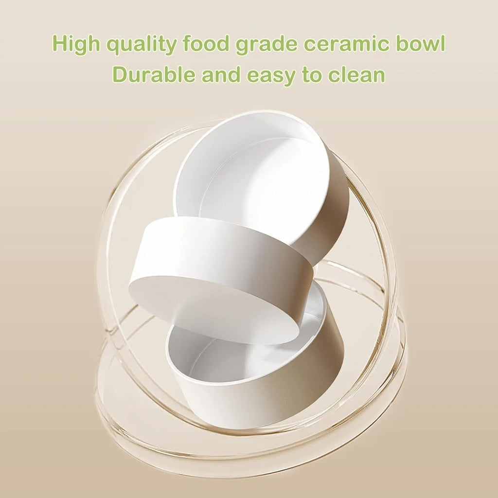 Green ceramic raised cat bowl set with two tilted bowls on a non-slip stand for food and water.