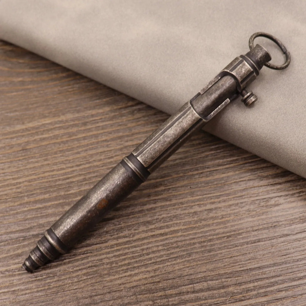 Brass tactical pen with press mechanism showing retro brass natural colour finish with hole pattern