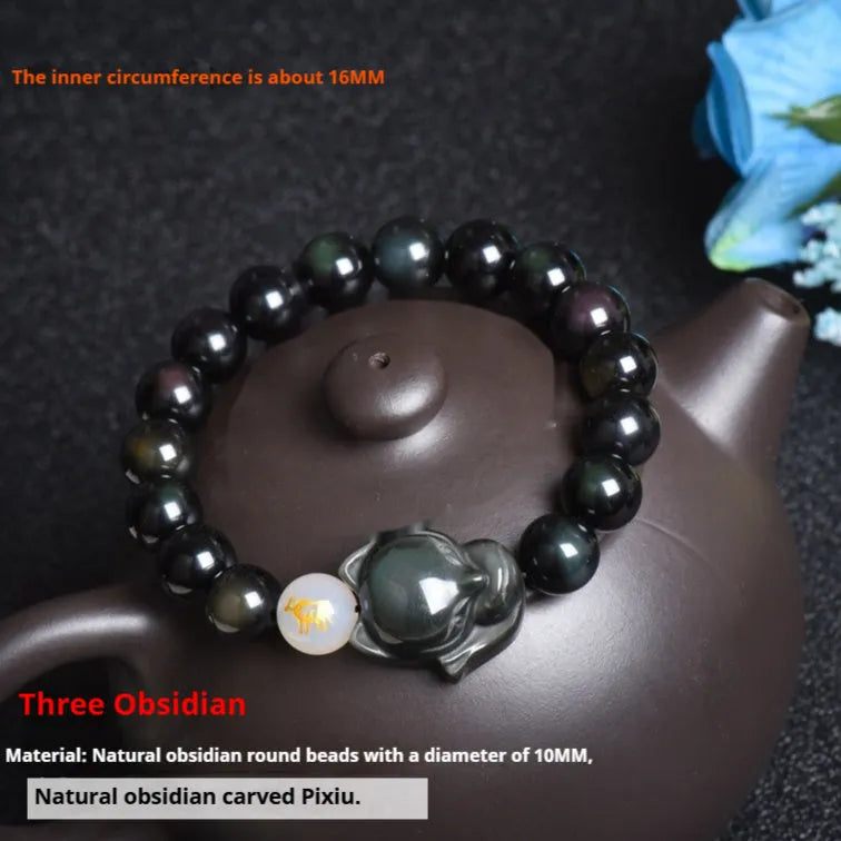 Natural obsidian bracelet with 10mm beads in gold, silver, or black finish.