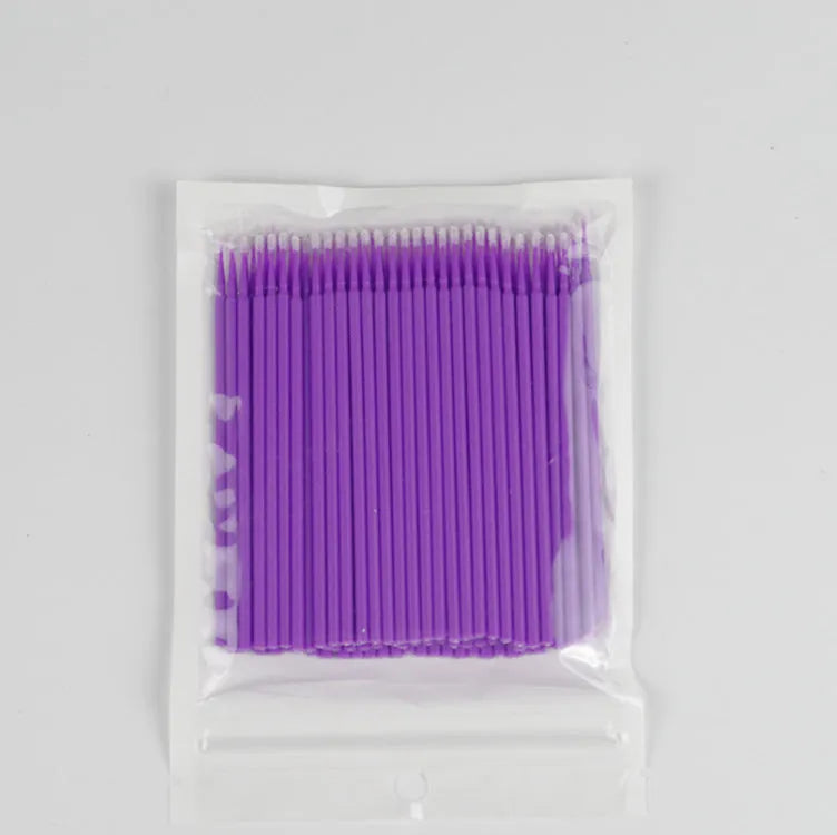 Disposable micro applicator brushes with bendable cotton tips and colour-coded handles for eyelash extensions