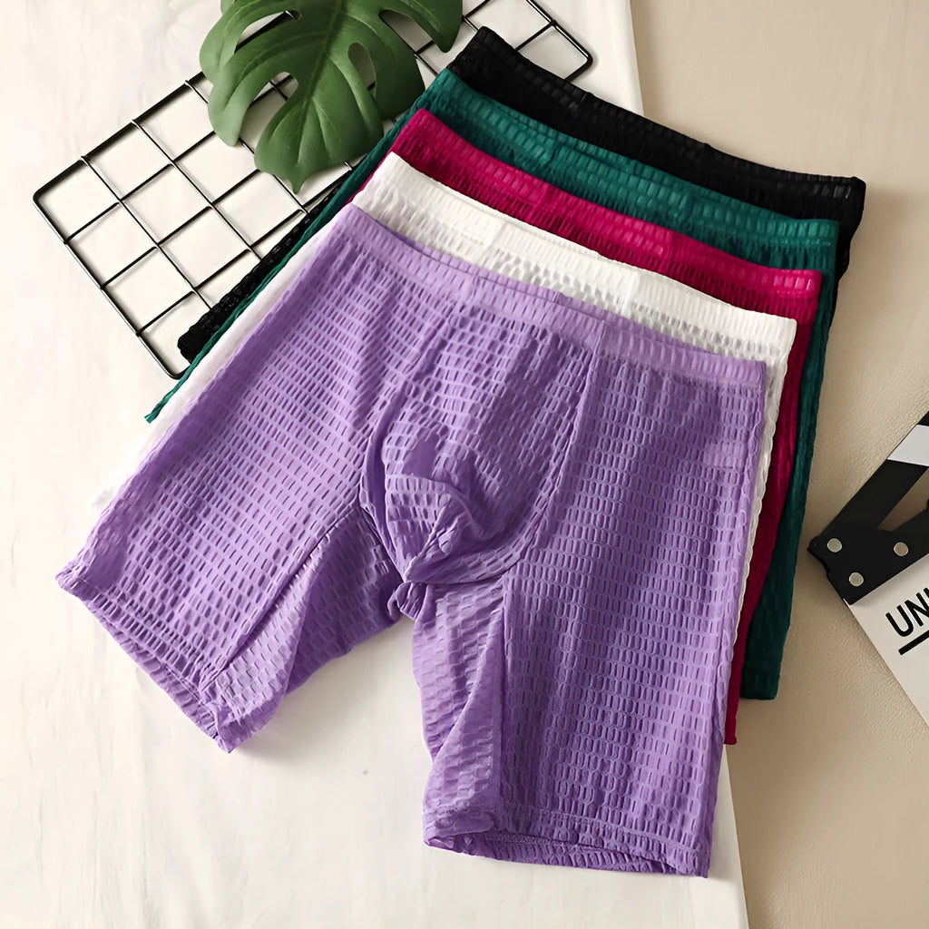 Men's lace boxer briefs in black on a white background, showing the lengthened hip design.
