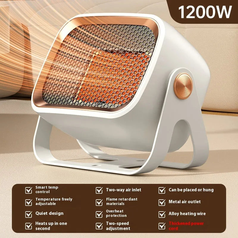 A compact grey desktop electric heater with a rotatable design on a wooden desk.