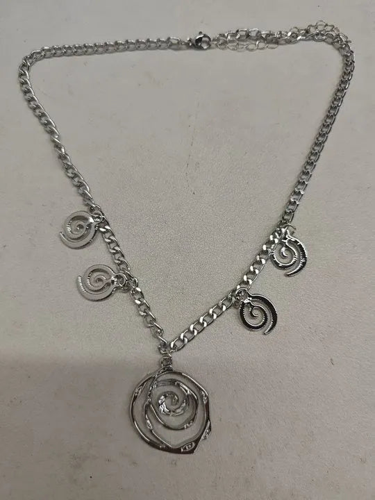 Gold or silver electroplated alloy jewellery set with spiral donut geometric shapes including necklace bracelet and ear hooks