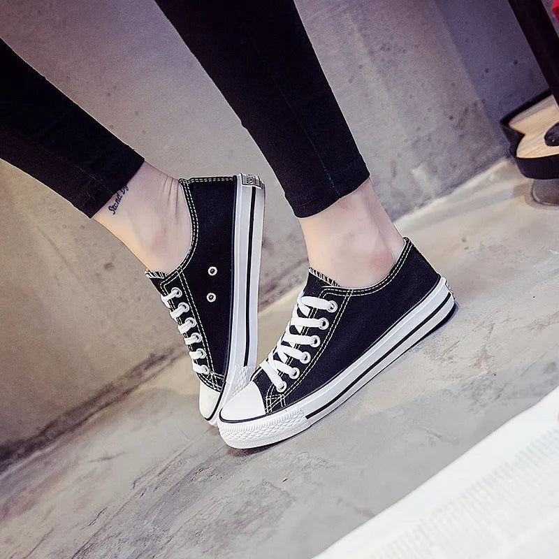 Women's solid colour canvas shoes in black, white and red colourways with casual design