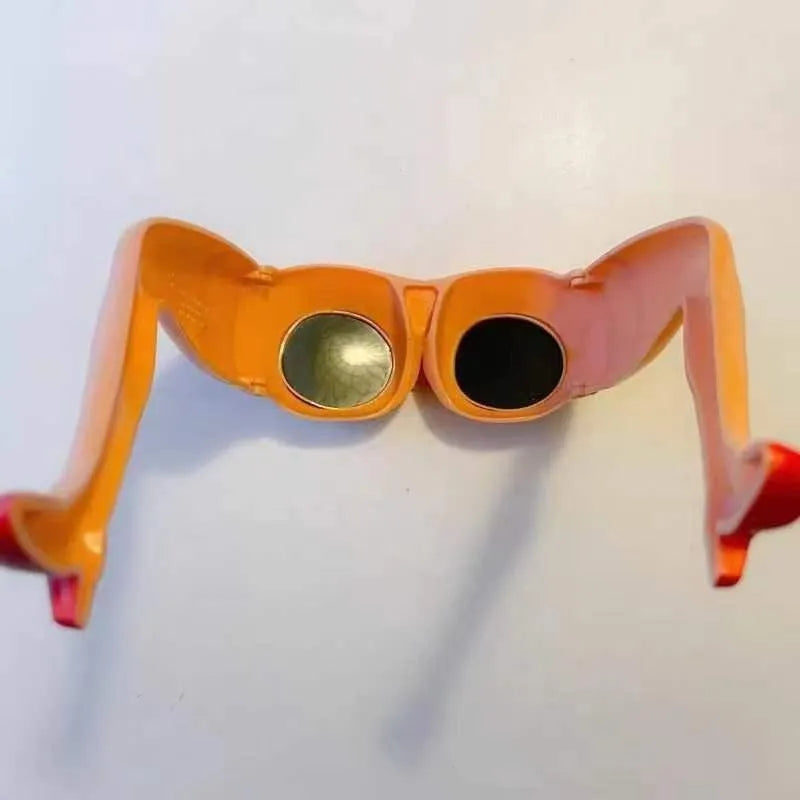 Orange plastic novelty sunglasses with a leg and hip design frame.