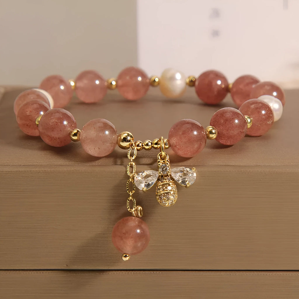 Women's bracelet with freshwater pearls and strawberry quartz stones with zircon accents on alloy hardware