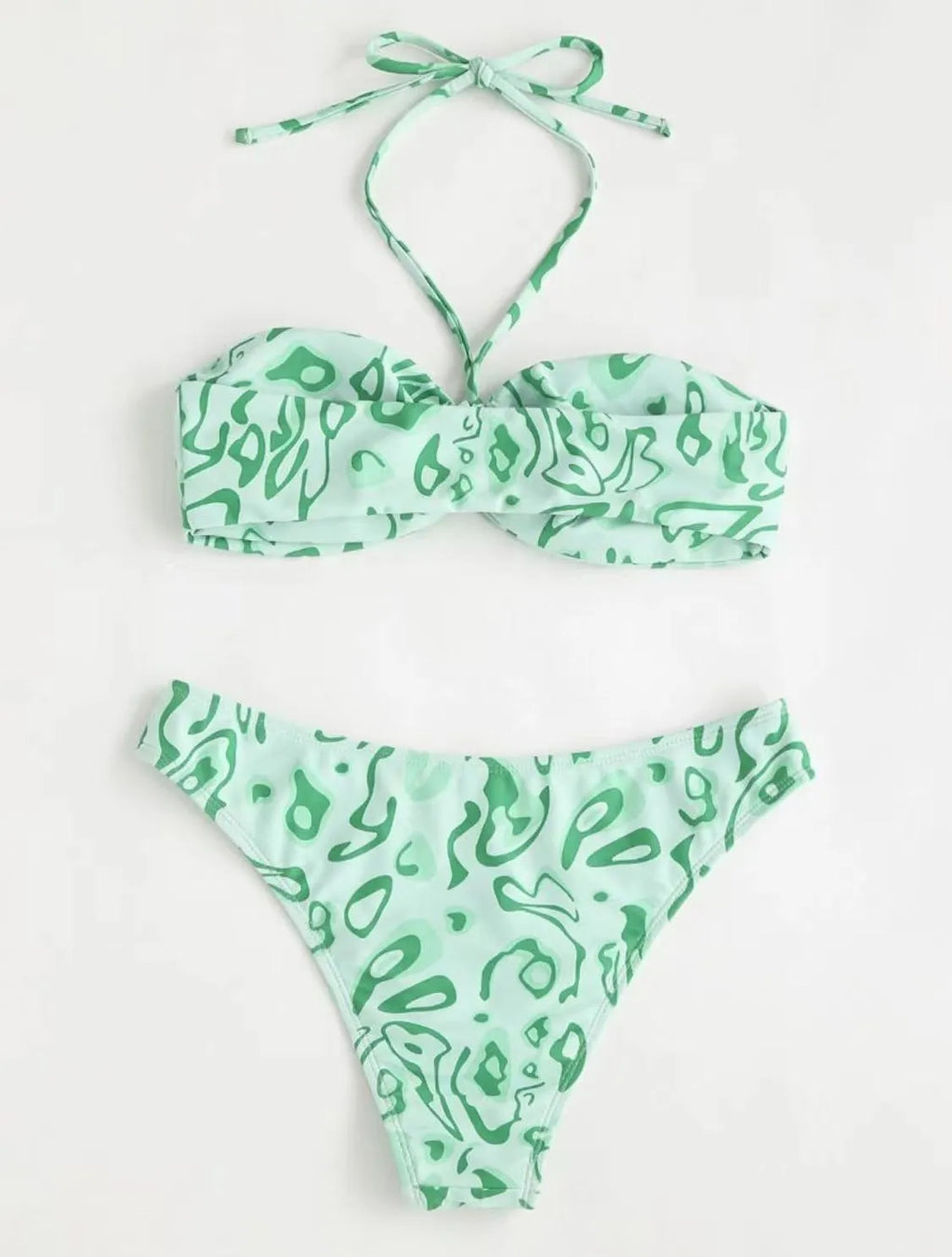 Green floral bandeau bikini swimsuit set with briefs on a neutral background.
