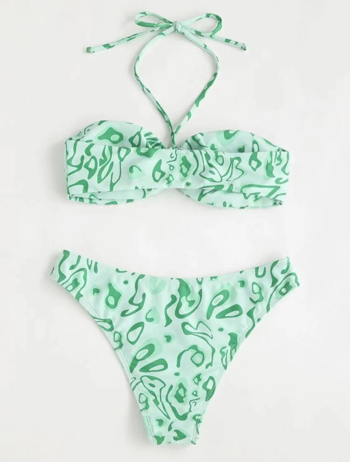 Green floral bandeau bikini swimsuit set with briefs on a neutral background.