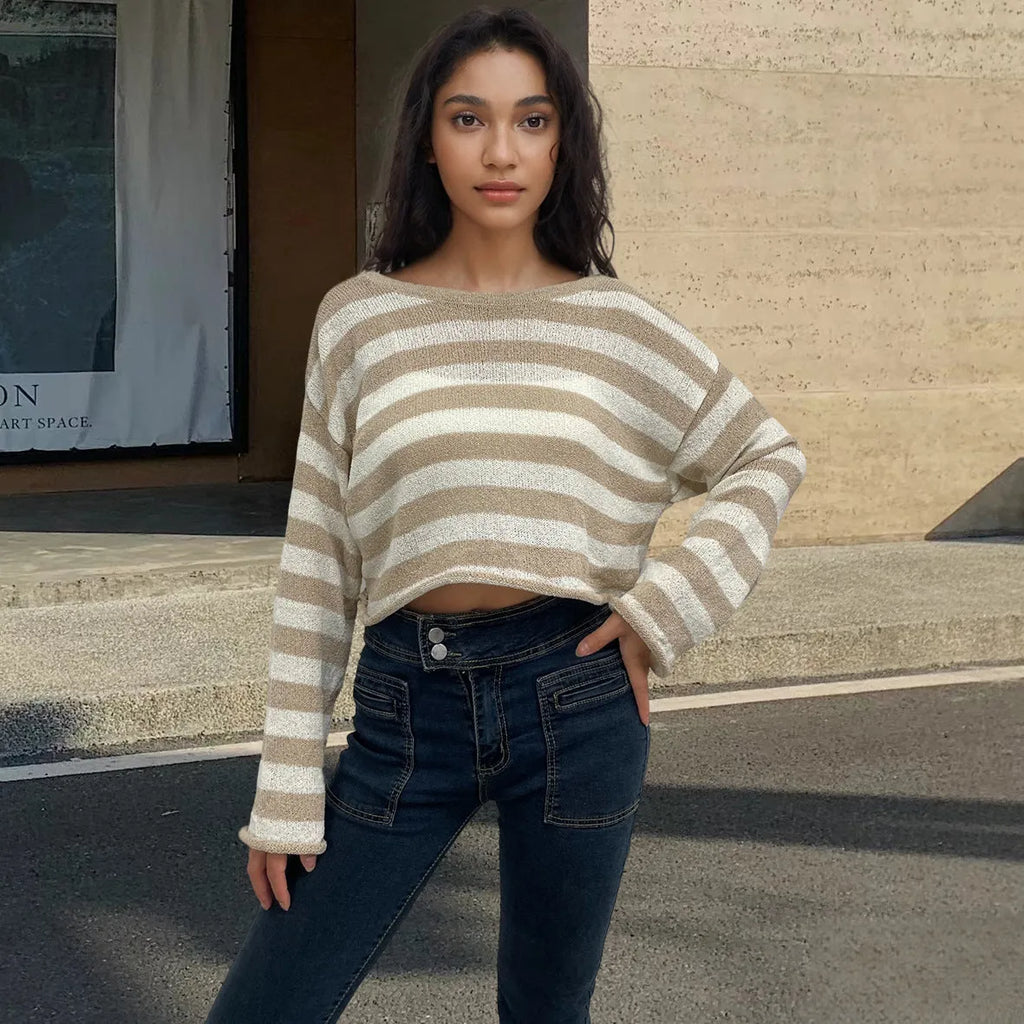 Women's black and white striped long-sleeved sweater with an exposed navel design, worn as a front and back wearable top.