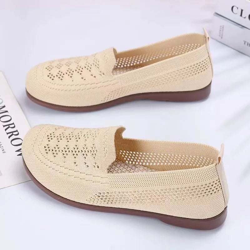 Women's beige low-top tennis shoes with mesh upper and anti-skid sole for wide feet.