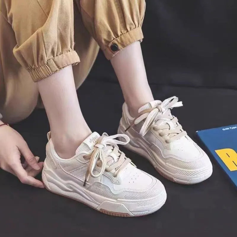 Low top rubber sneaker in pink or milky white with height increasing sole and breathable design