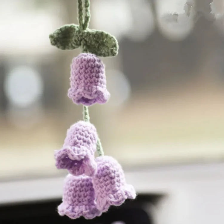 Green and white knitted wool car plant decoration with plastic base and hanging rope
