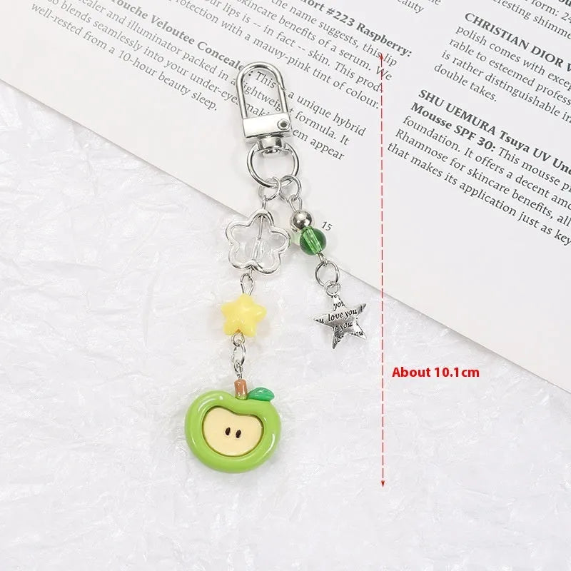 Plastic resin iPhone charm bag pendant keychain with fruit patterns including apple core and strawberry designs