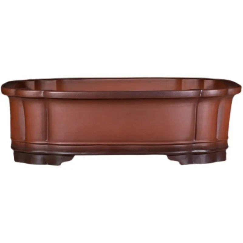 Large antique-finish Chinese purple clay flower pot with decorative tree stump and floral motifs.