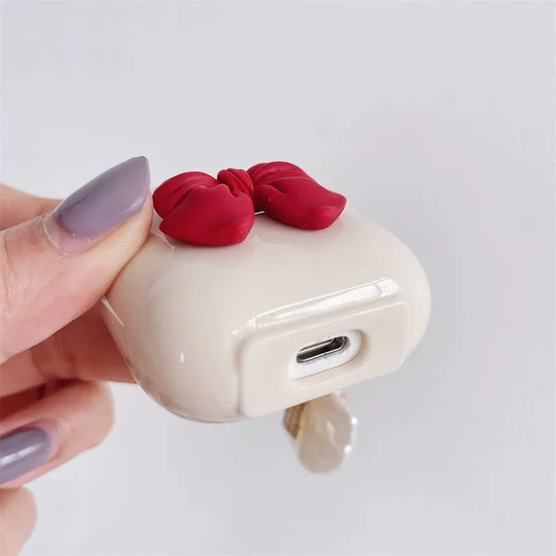 Beige red bow shell TPU protective case with clamshell closure for AirPods Pro wireless earphones