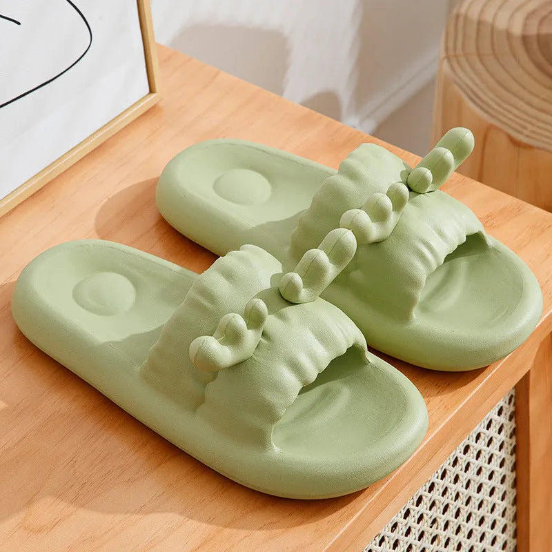 Pair of light-coloured EVA flip flop slippers with hollow-out design and textured sole.