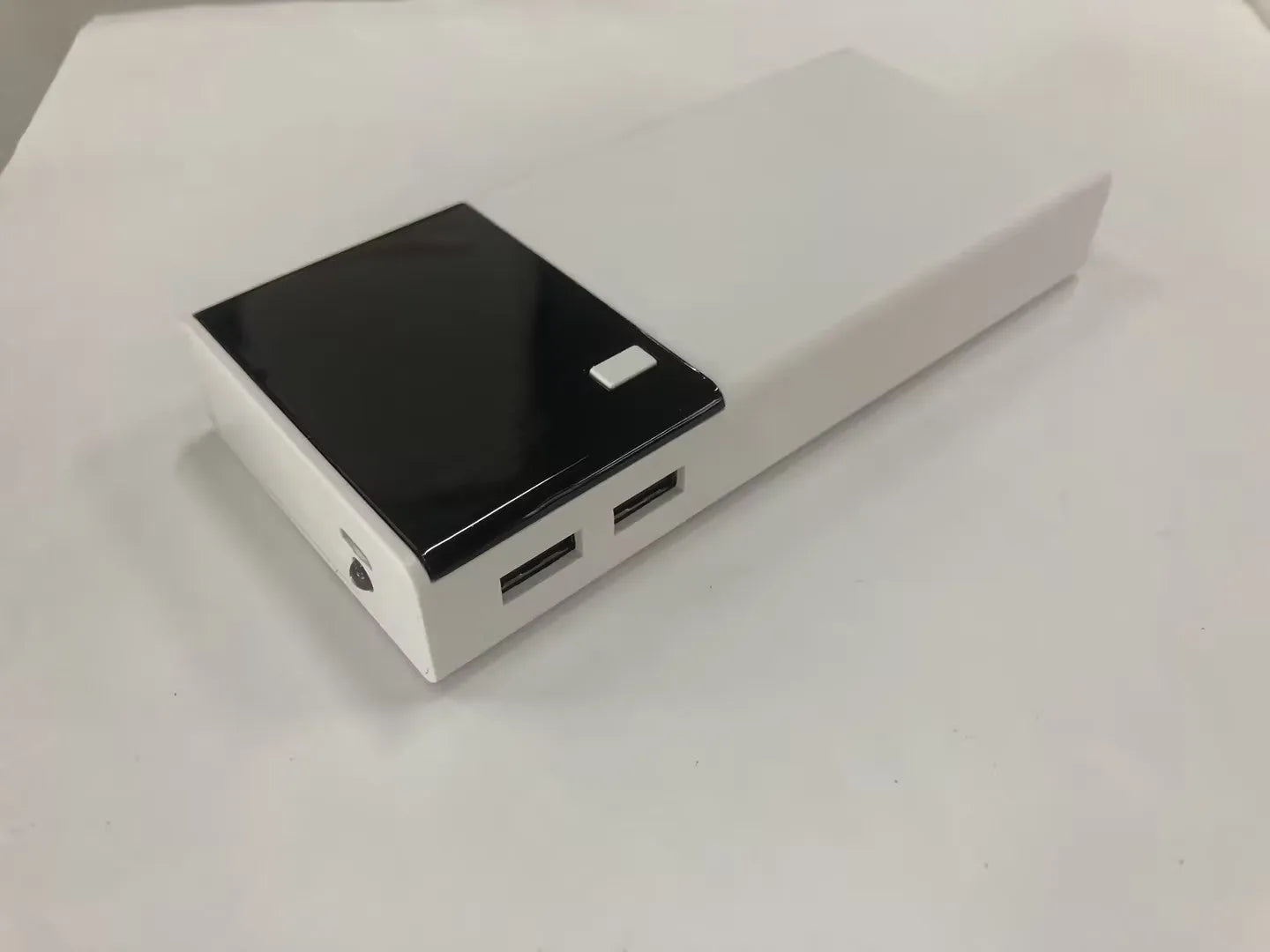 Black Rice brand 20000mAh portable power bank with charging cable.