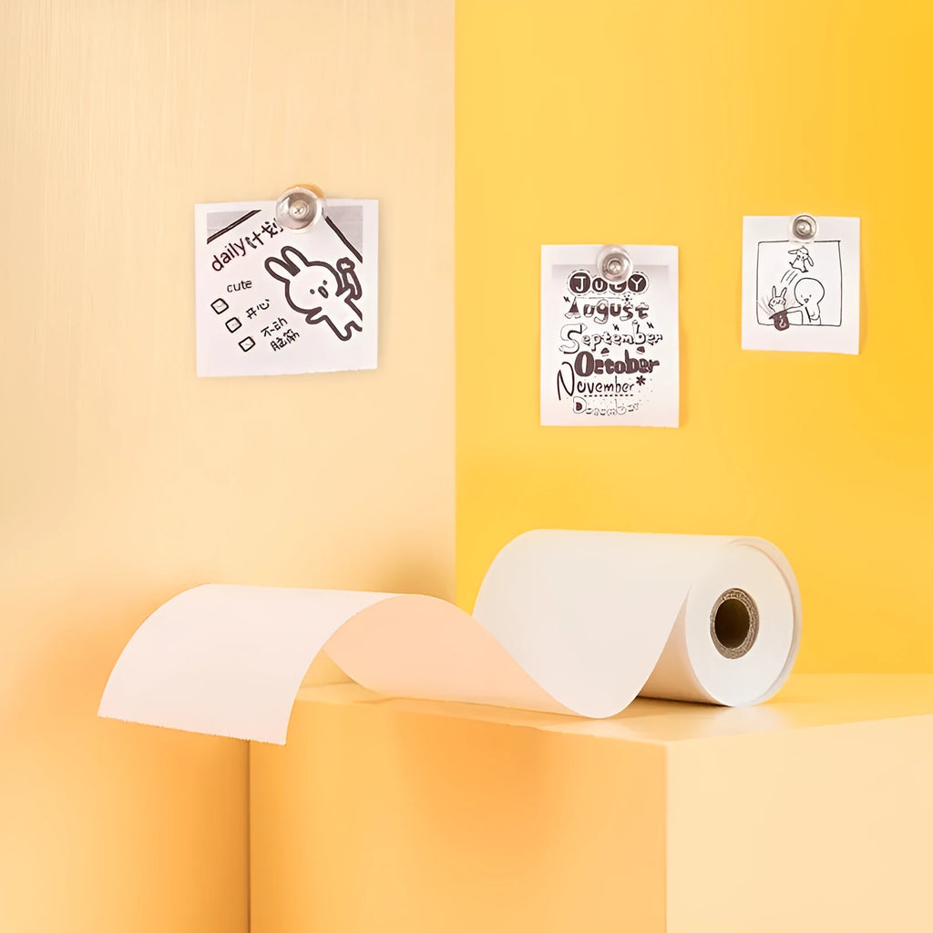 Three rolls of 57mm thermal paper in packaging for small printers