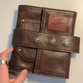 Brown retro leather buckle notebook with loose-leaf binding and A7 size dimensions