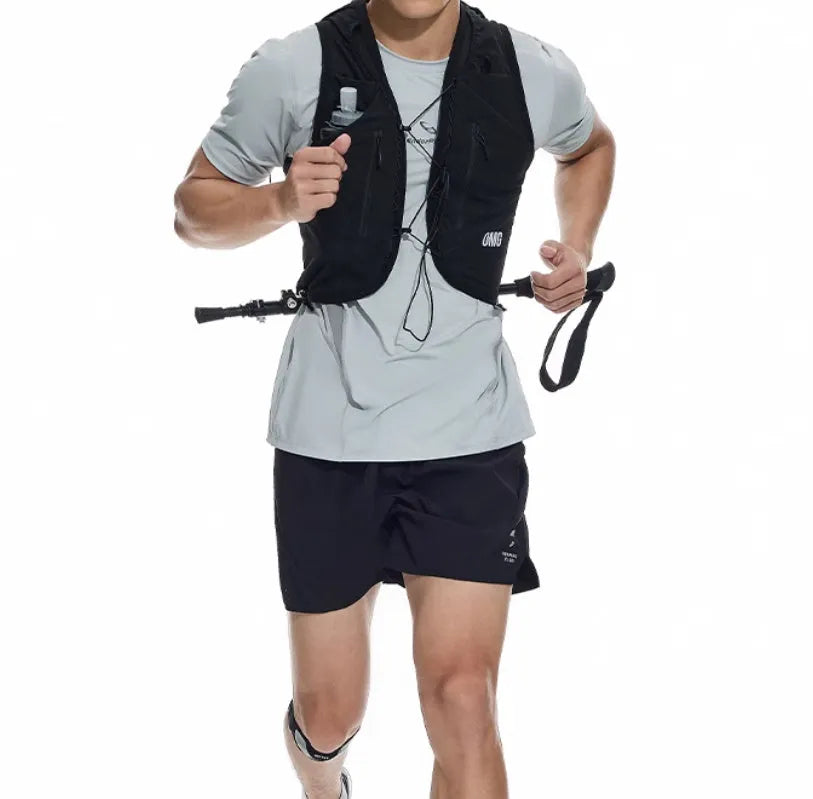 Men's black four-point stretch running shorts with laser-stitched seams on a grey background.