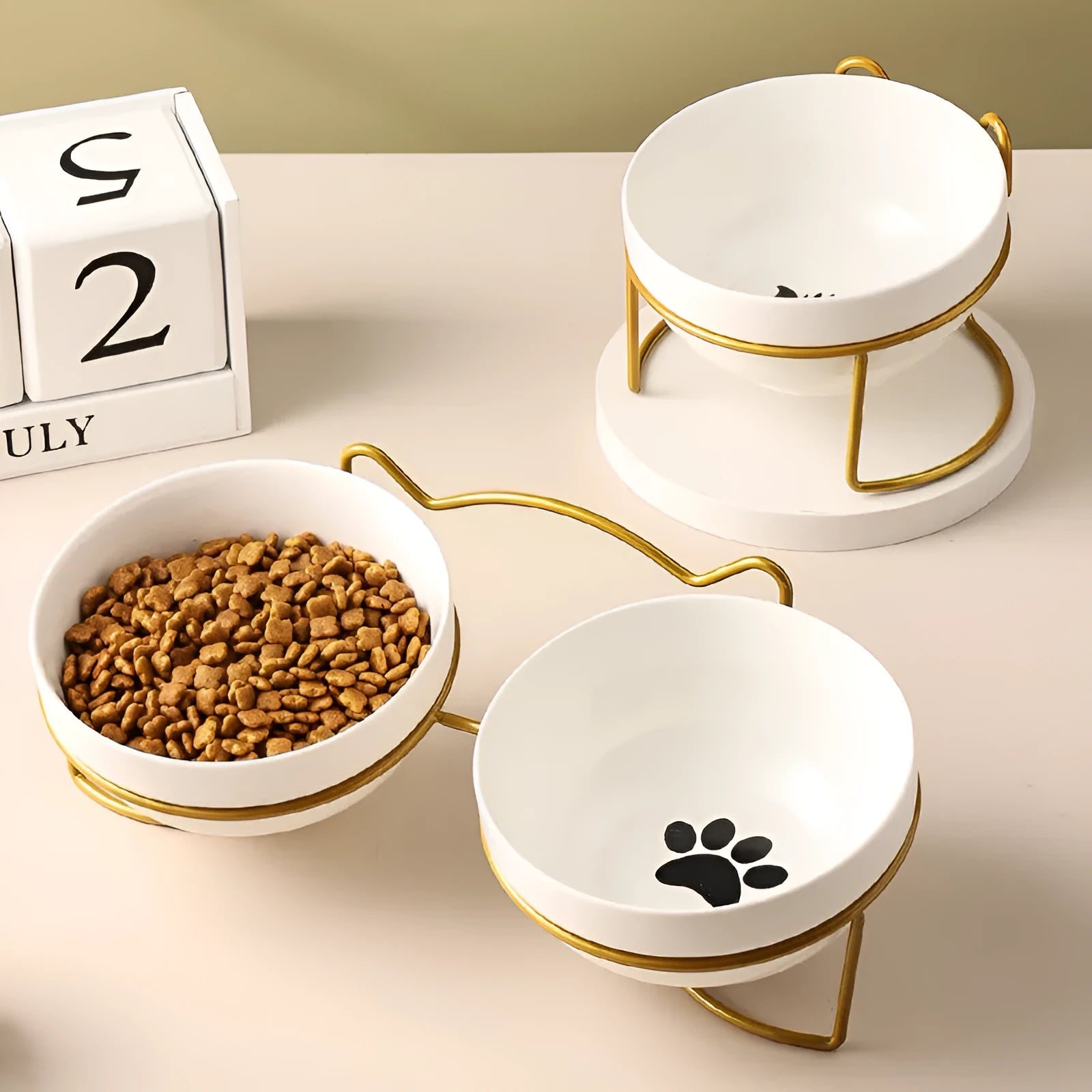 White ceramic pet bowl with cat footprints pattern in black iron cat ear frame