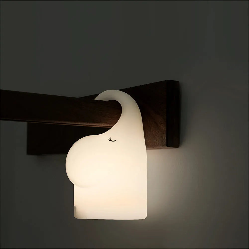 Elephant-shaped silicone night light with warm LED illumination for bedroom bedside use