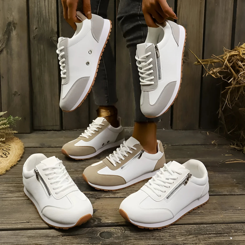 Women's flat-heeled shoes in champagne colour with artificial PU upper and rubber sole.