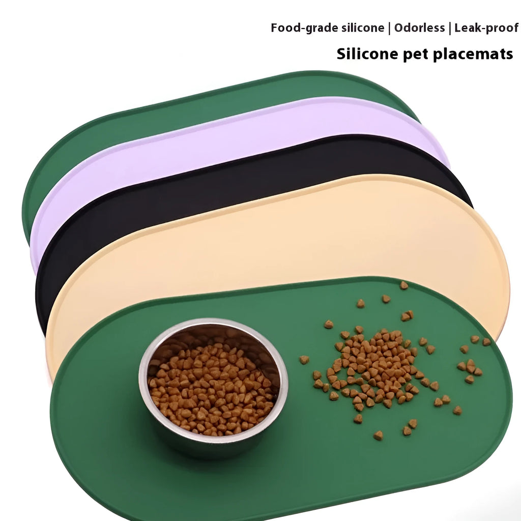 Silicone waterproof cat feeding placemat in green, shown under a food bowl.