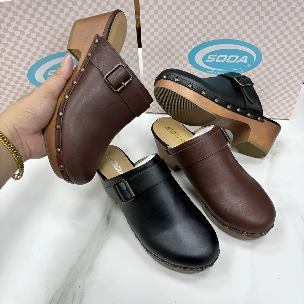 Black retro women's slippers with a chunky heel, closed toe, decorative rivets, and a rubber sole.