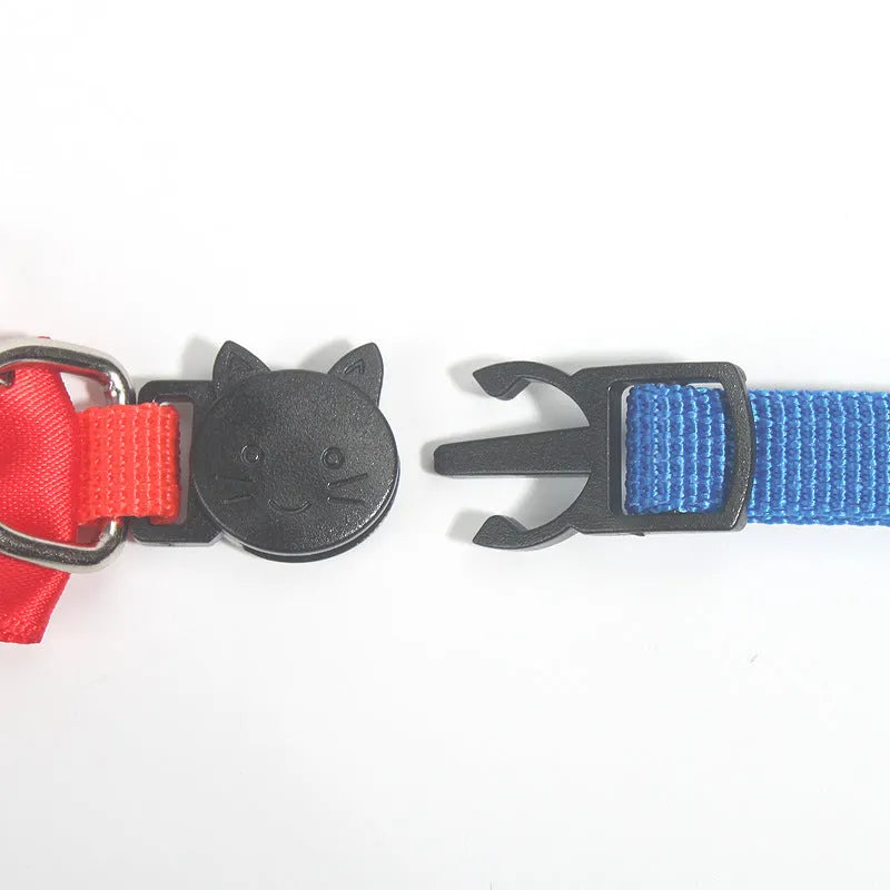 Adjustable striped nylon cat collar with bell in various colors including red, green, and blue