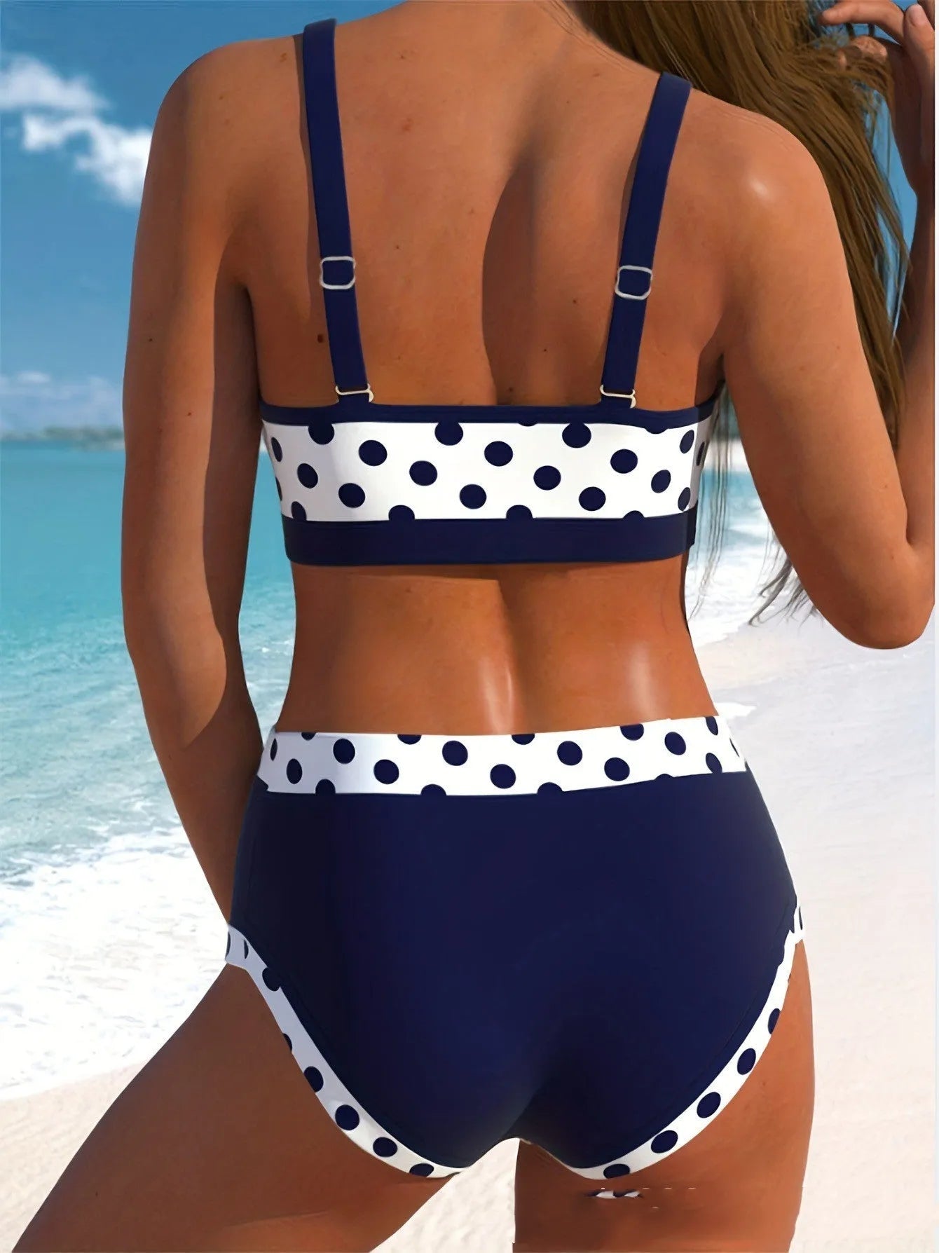 Men's multicolour small dot patterned swim briefs on a white background, showing the split design.