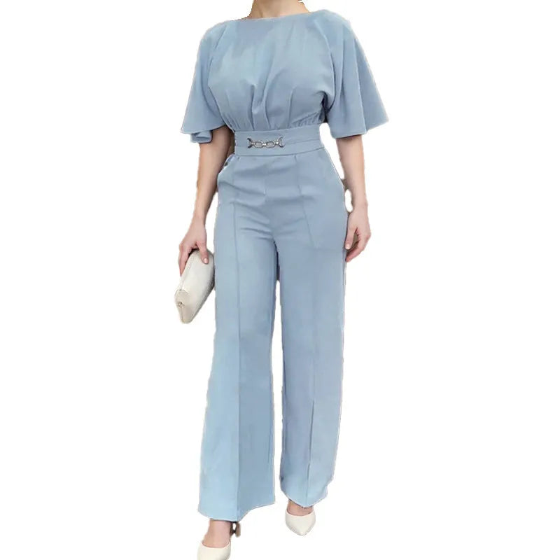 Blue men's slim fit two-piece polyester suit with long sleeve jacket and trousers on a hanger.