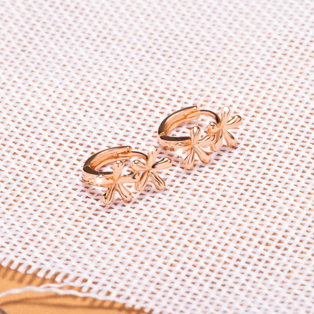 Rose gold coloured circular waterdrop flower earrings with an electroplated finish.