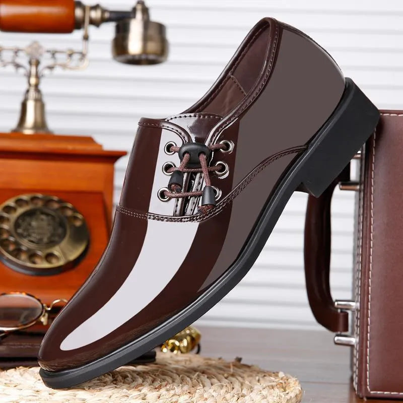 Men's black and brown formal oversleeve shoes with round toe and square heel on a rubber sole.