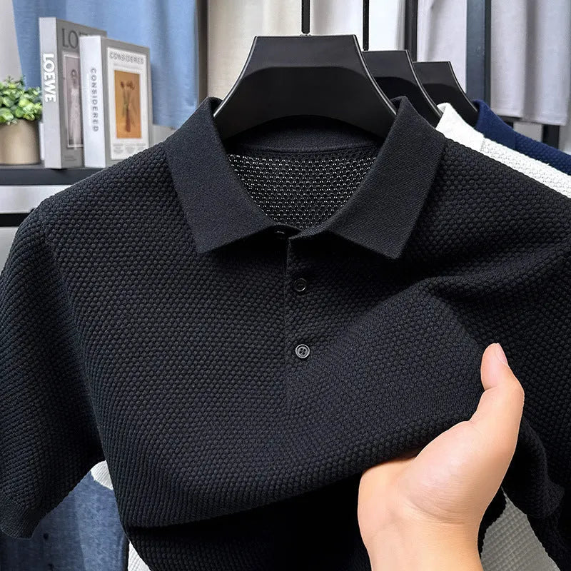 A loose-fitting short sleeve cotton pullover sweater on a hanger, shown in one of the six available colours.
