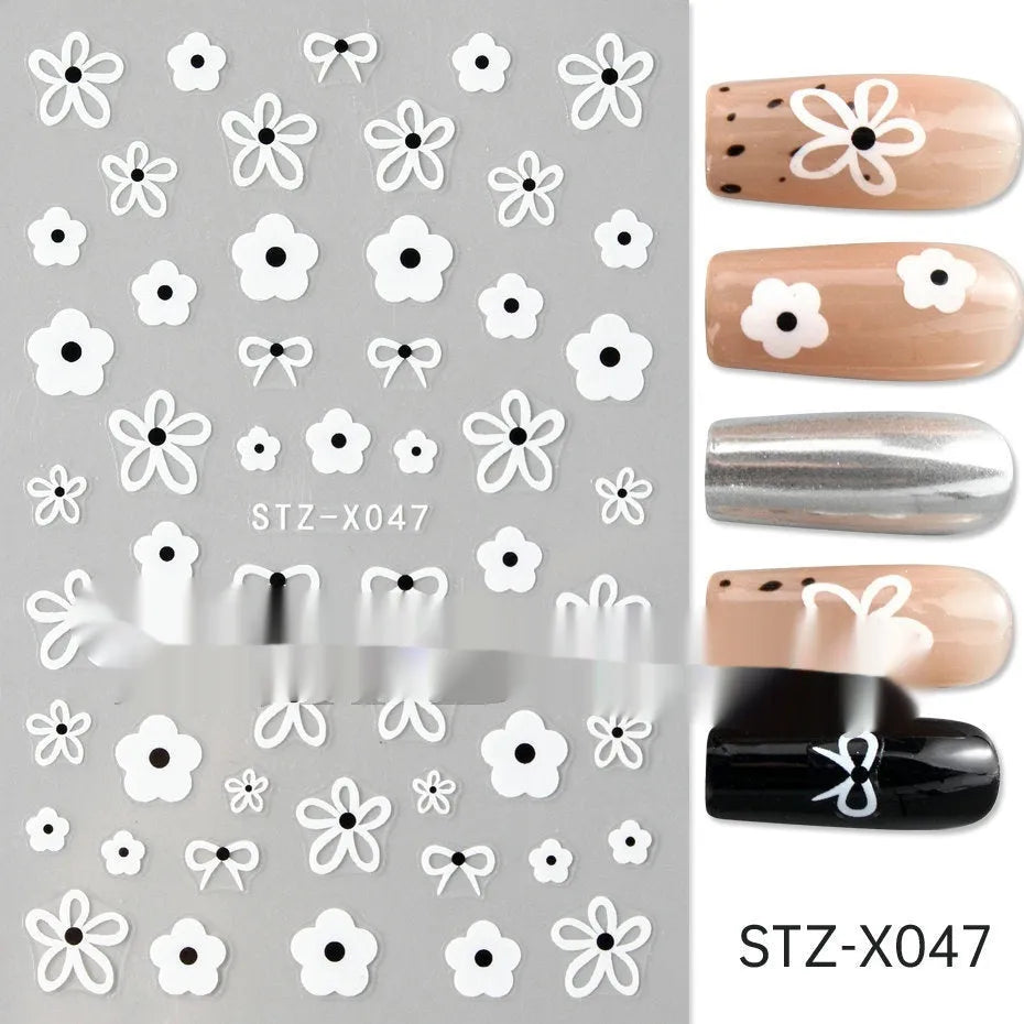 Cartoon love pattern nail art sticker decals in black and silver colours on a plastic sheet.