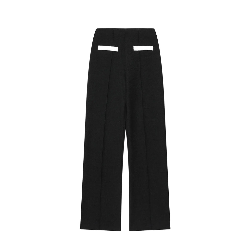 Women's beaded top and high-waisted trouser co-ord suit in contrasting colours, street fashion style.