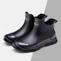 PVC outdoor wading shoes in black and red with a non-slip plastic sole and short-tube design.